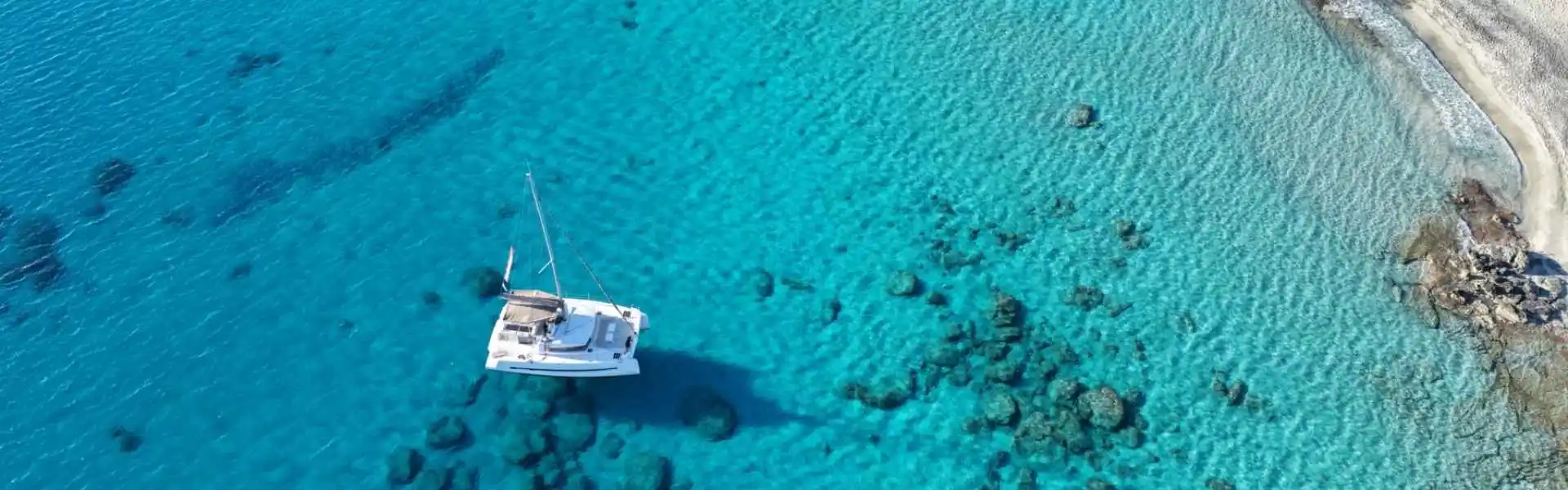 Catamaran sailing near Elafonisi, Crete, during a cruise from Paleochora.