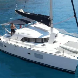 Lagoon 380 S2 catamaran sailing on clear blue waters near Kissamos, Crete, used for private cruises to Balos and Gramvoussa.
