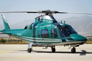 Agusta A109 Power helicopter departing from Athens Airport for a luxury private helicopter transfer in Greece.