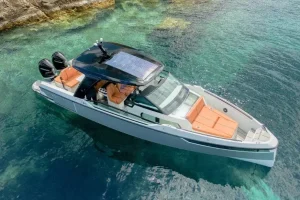 Aerial view of Saxdor 320 GTO luxury motor yacht anchored in turquoise waters in Paros Greece