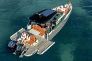 Guests relaxing on the aft deck of a Saxdor 320 luxury yacht in Paros Greece