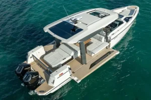 Saxdor 400 GTO luxury motor yacht cruising in turquoise waters near Paros, Greece